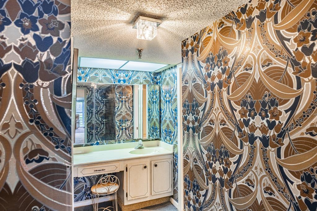 9165 Southwest 14th Street, Unit 1204 Boca Raton, FL 33428 - Photo 14 of 30 Master bathroom with unique wallpaper