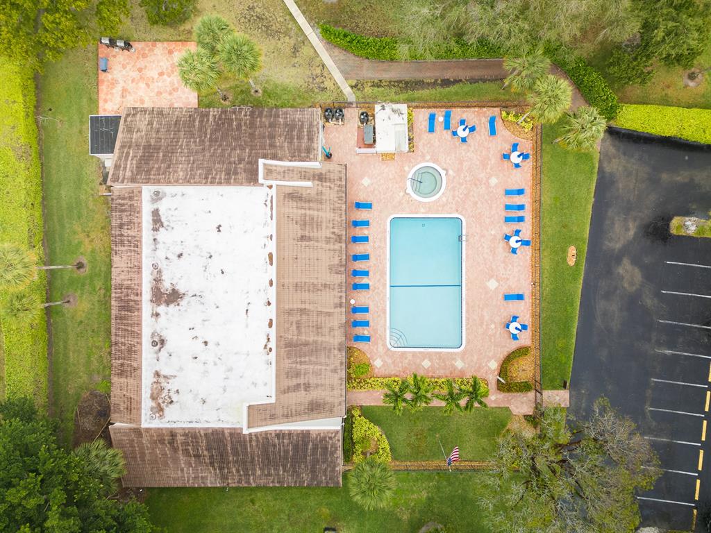 9165 Southwest 14th Street, Unit 1204 Boca Raton, FL 33428 - Photo 25 of 30 Clubhouse and pool on east side of building