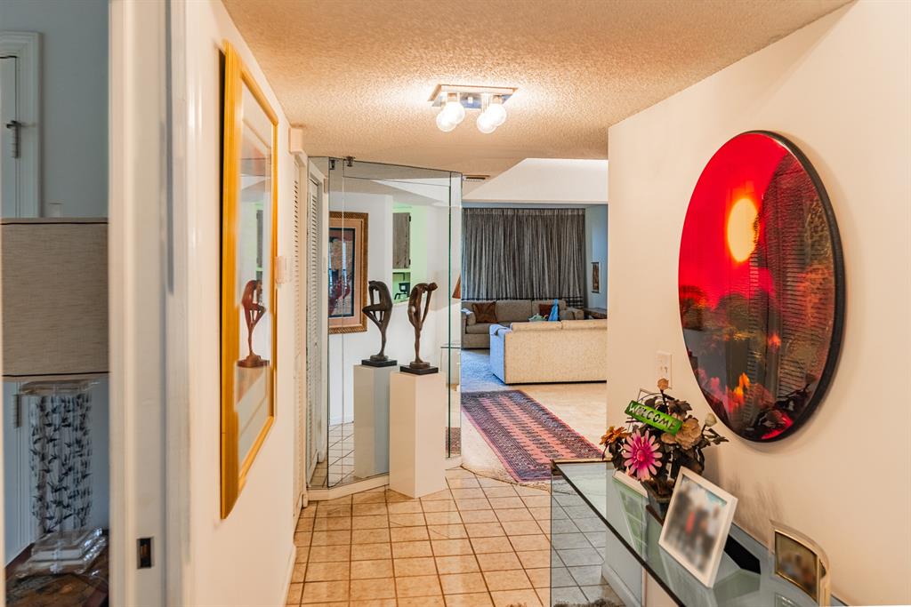 9165 Southwest 14th Street, Unit 1204 Boca Raton, FL 33428 - Photo 6 of 30 Entry facing dining and living room