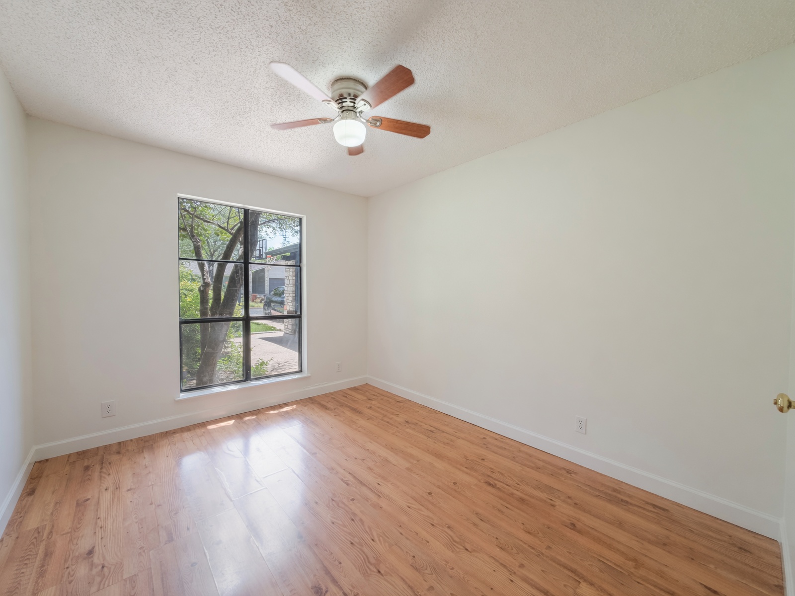 5310 Presidio Road Austin, TX 78745 - Photo 17 of 31 Bedroom 1 and a large window define this naturally illuminated bedroom space.