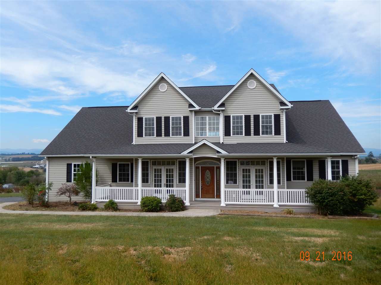 2437 Fadley Road Bridgewater, VA 22812 - Photo 1 of 22 a front view of a house with a garden and porch