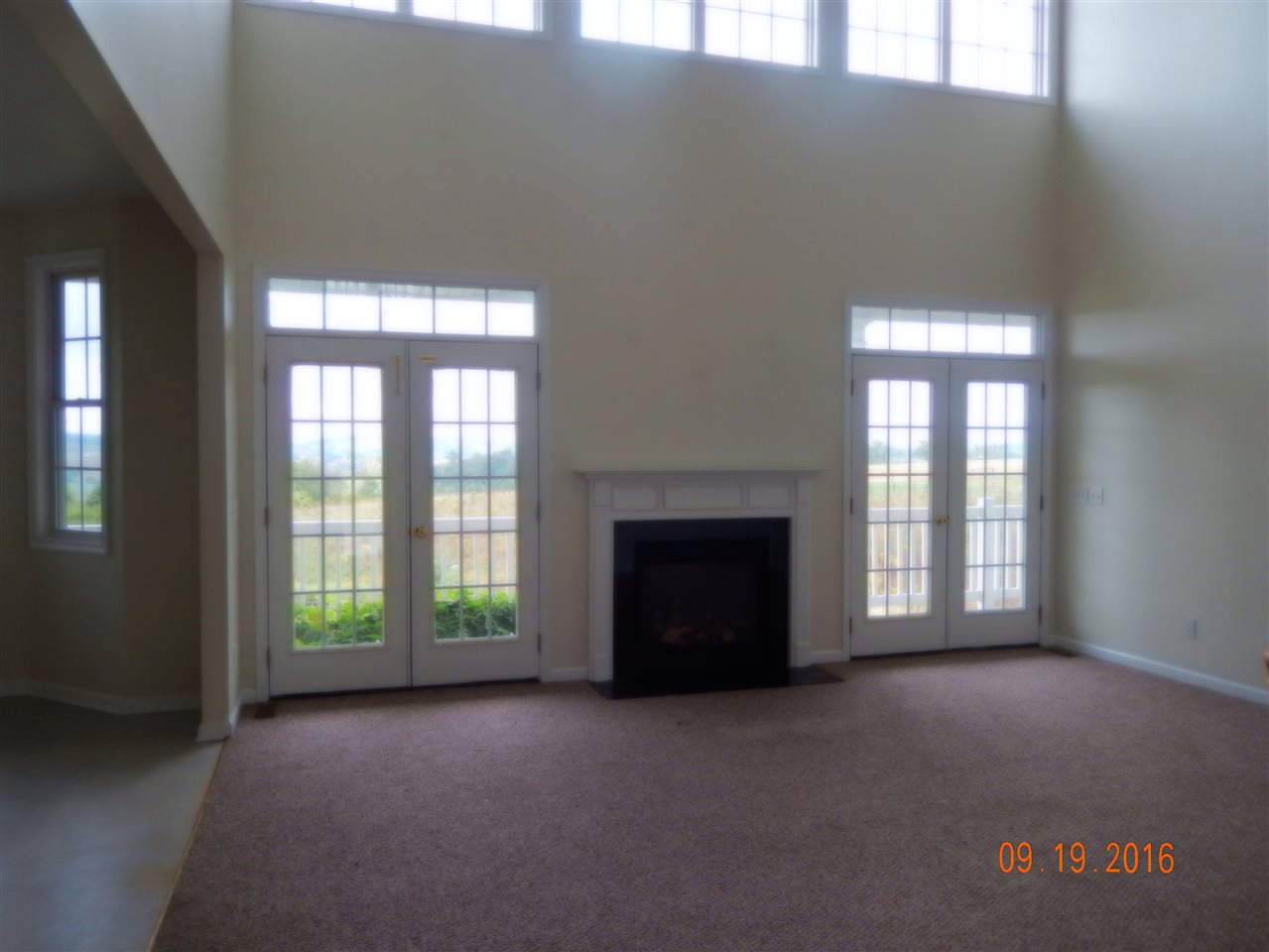 2437 Fadley Road Bridgewater, VA 22812 - Photo 11 of 22 a view of an empty room with a fireplace and a window