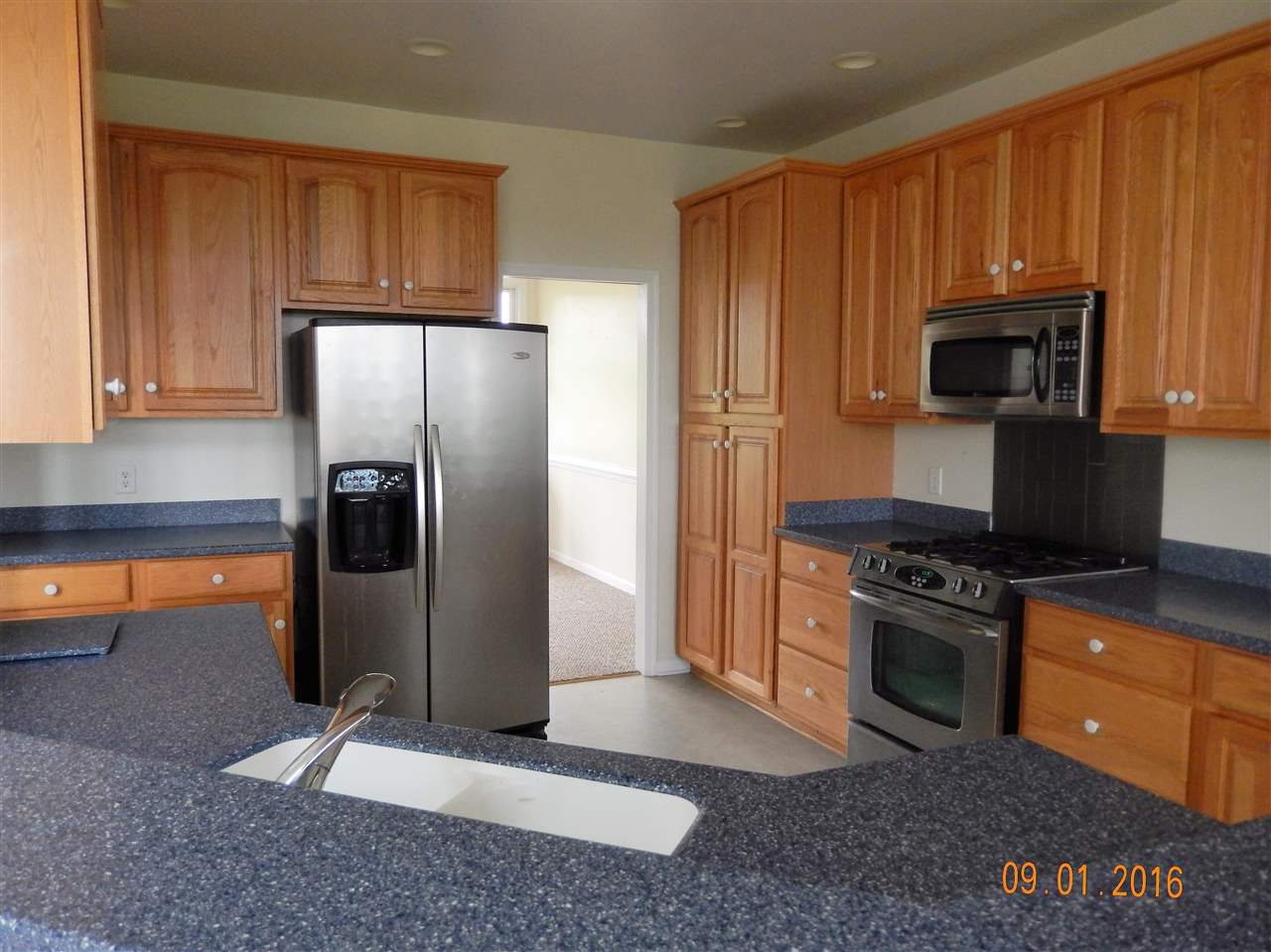 2437 Fadley Road Bridgewater, VA 22812 - Photo 5 of 22 a kitchen with stainless steel appliances granite countertop a refrigerator stove and microwave