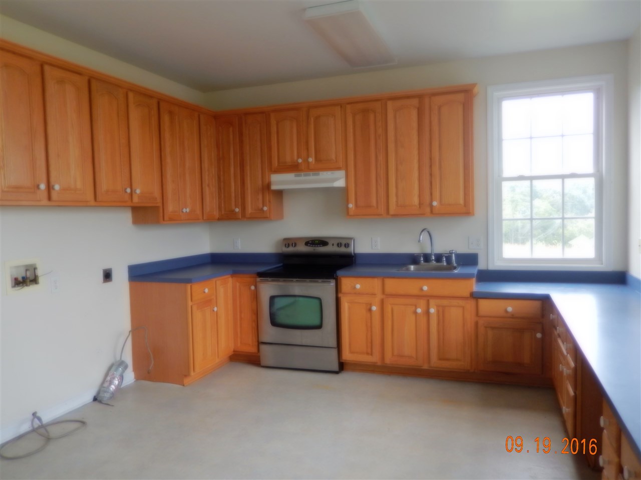 2437 Fadley Road Bridgewater, VA 22812 - Photo 10 of 22 a kitchen with stainless steel appliances granite countertop a stove a sink and a microwave