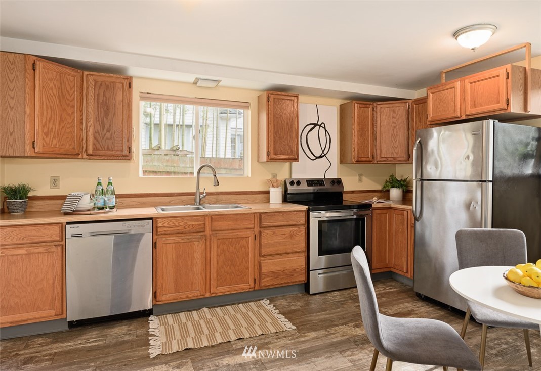 1809 North 41st Street Seattle, WA 98103 - Photo 11 of 32 a kitchen with a refrigerator and a sink