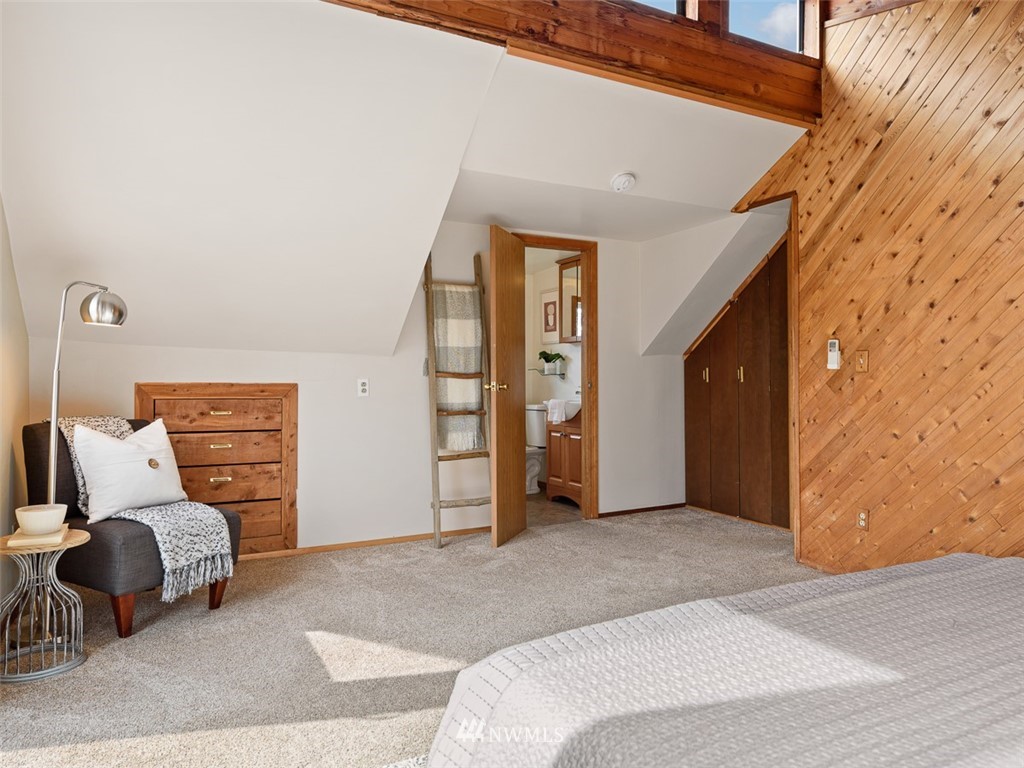 1809 North 41st Street Seattle, WA 98103 - Photo 16 of 32 a bedroom with a bed and a couch