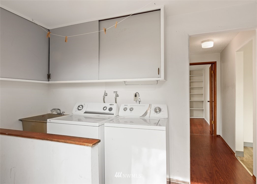 1809 North 41st Street Seattle, WA 98103 - Photo 24 of 32 a utility room with sink dryer and washer