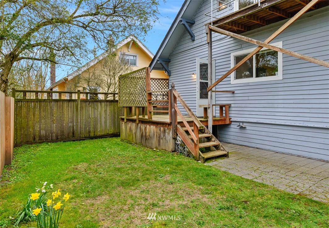 1809 North 41st Street Seattle, WA 98103 - Photo 26 of 32 a view of a backyard with a garden and deck
