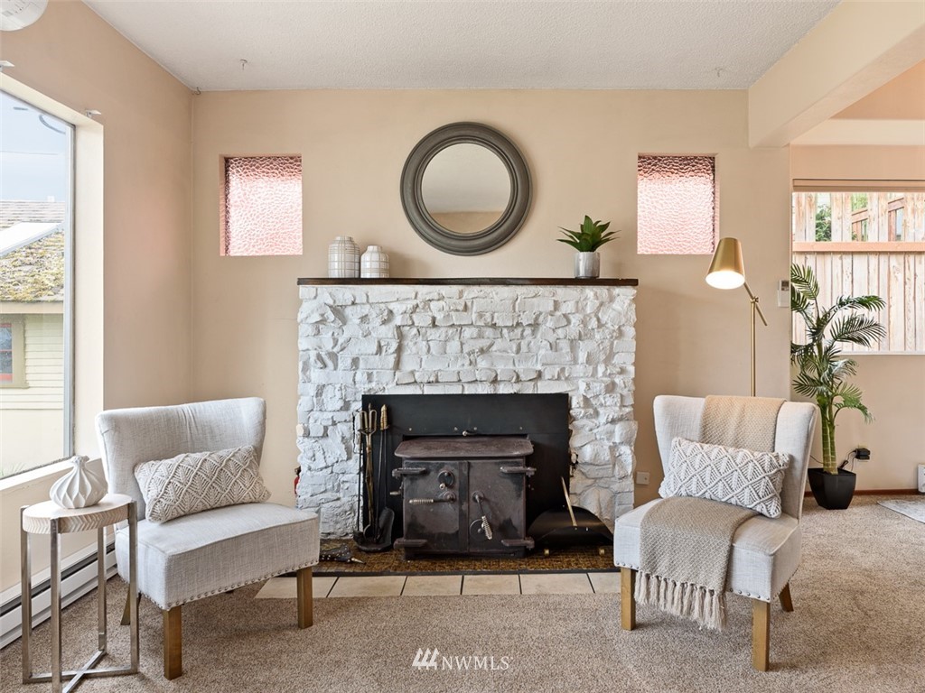 1809 North 41st Street Seattle, WA 98103 - Photo 6 of 32 a living room with furniture and a fireplace