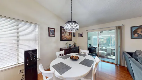 a dining room with furniture and window