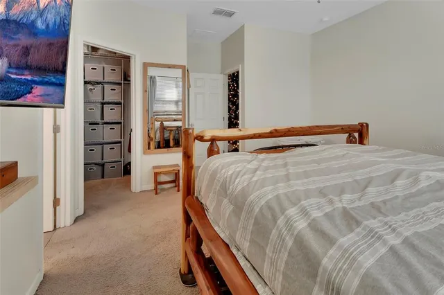 a bedroom with a bed and closet