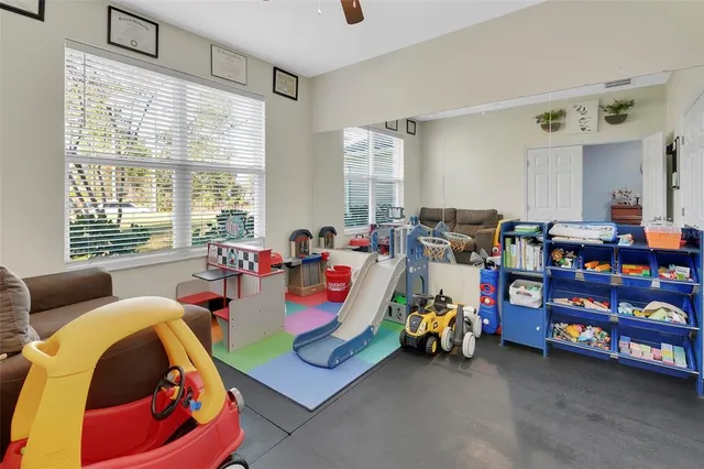 a bed room with furniture and a window