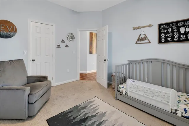 a bedroom with a bed and a couch