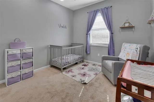 a bedroom with furniture and a window