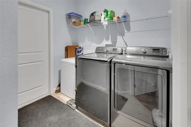 a kitchen with stainless steel appliances granite countertop a sink and a stove