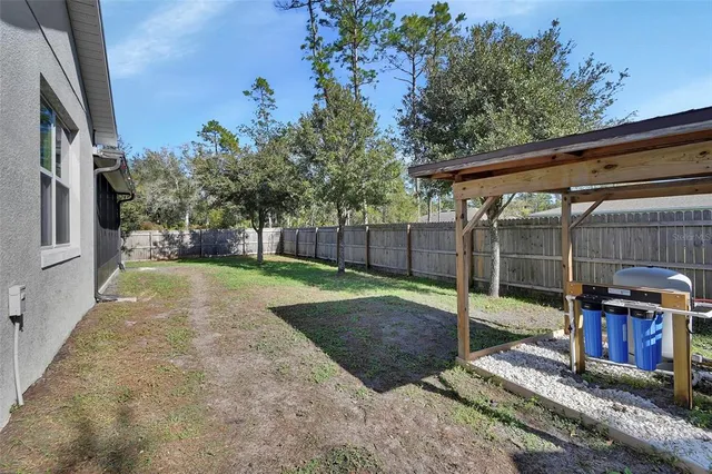 a view of a backyard with tub