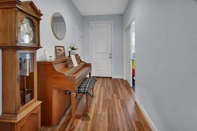 a view of a living room with wooden floor