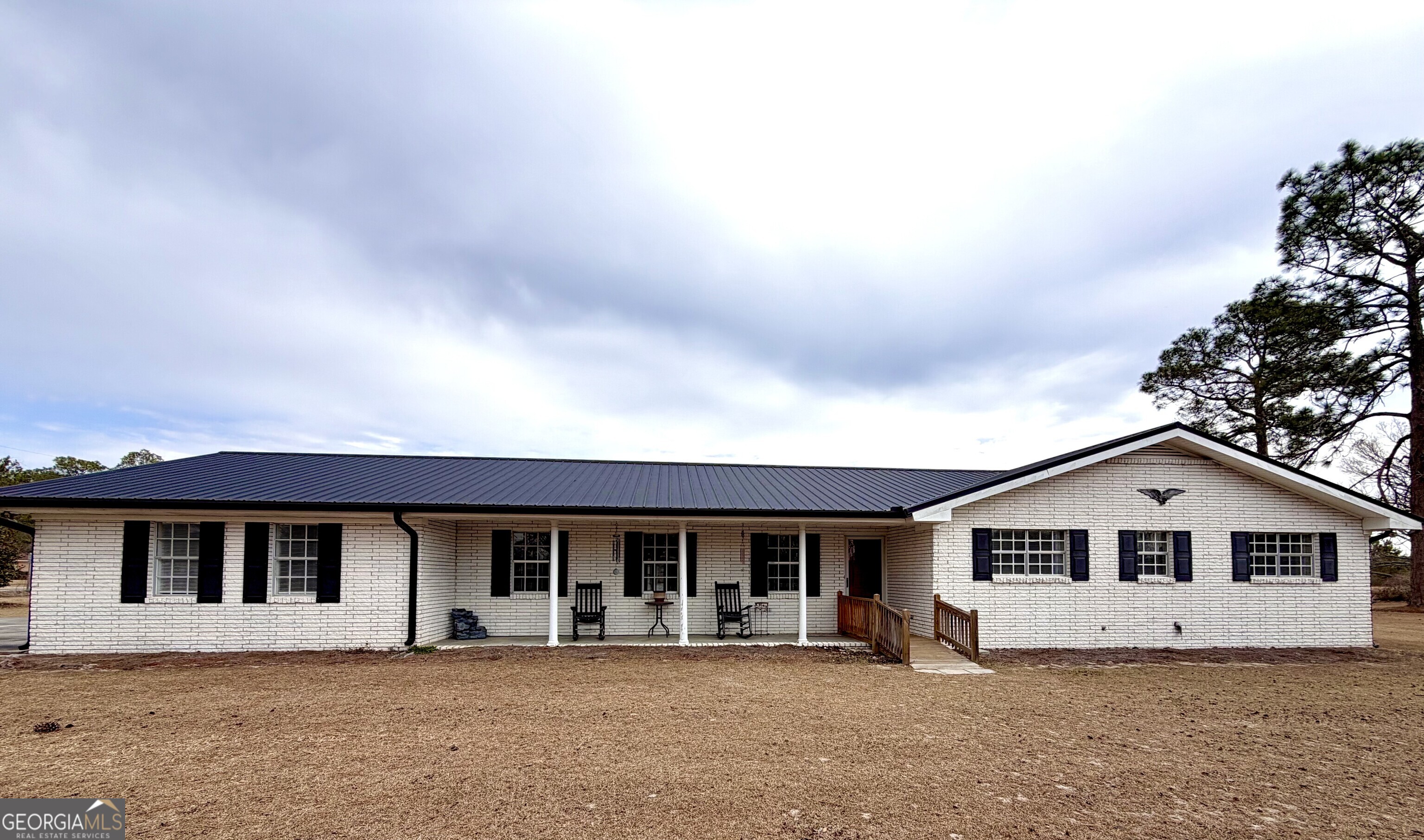 825 Satilla Church Road Baxley, GA 31513 - Photo 1 of 1 a front view of a house with a yard