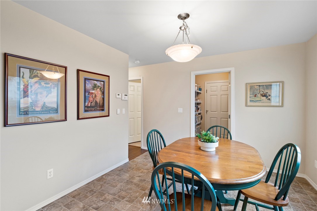 1311 190th Street Southeast Bothell, WA 98012 - Photo 14 of 39 a view of a dining room with furniture and wooden floor