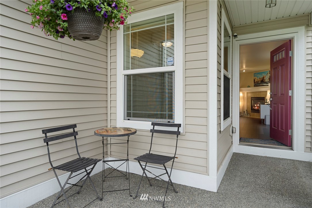 1311 190th Street Southeast Bothell, WA 98012 - Photo 3 of 39 a view of chair and table in the balcony