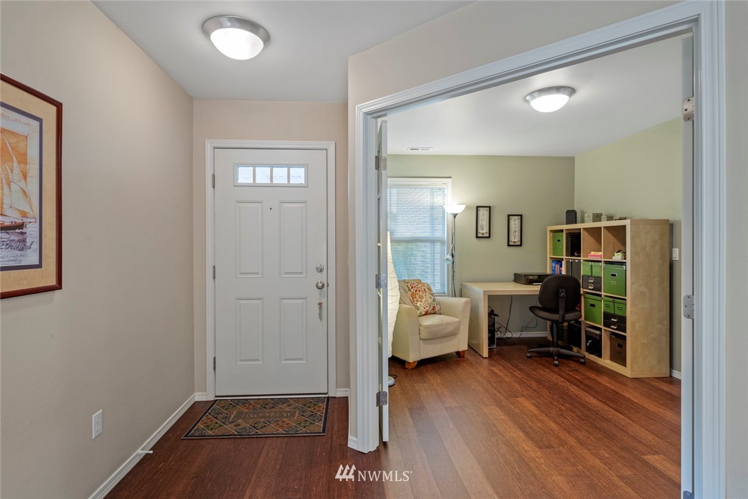 1311 190th Street Southeast Bothell, WA 98012 - Photo 4 of 39 a view of livingroom with furniture and wooden floor