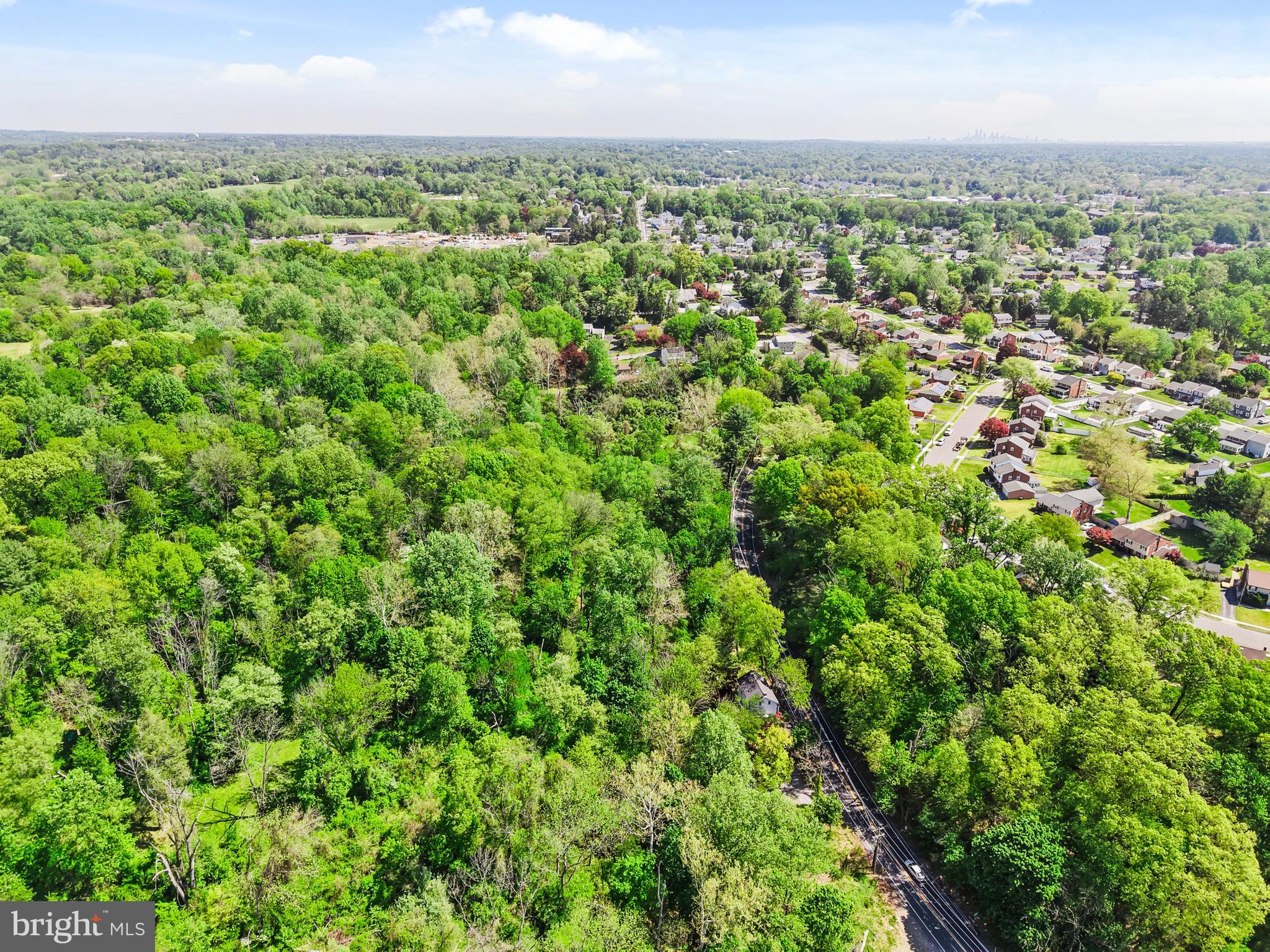 386 Dutton Mill Road Brookhaven, PA 19015 - Photo 6 of 12 an aerial view of residential houses with outdoor space and trees