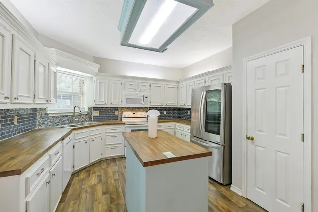 a kitchen with a sink and cabinets