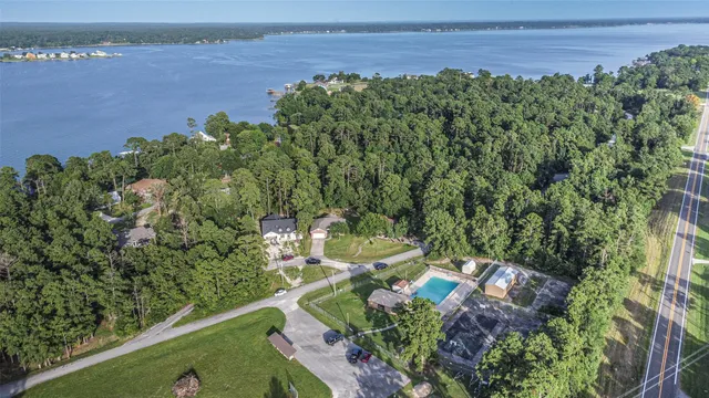 a view of kitchen with granite countertop cabinets a sink and stainless steel appliances