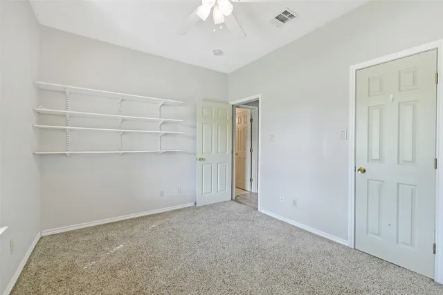 a view of an empty room with windows