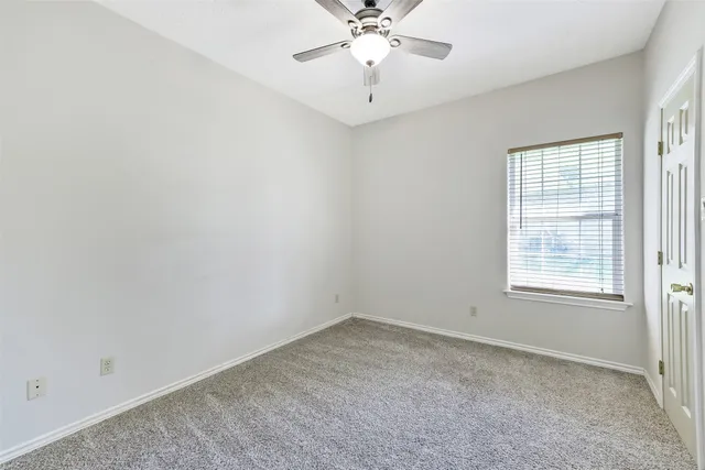 a view of a chairs and table in the patio