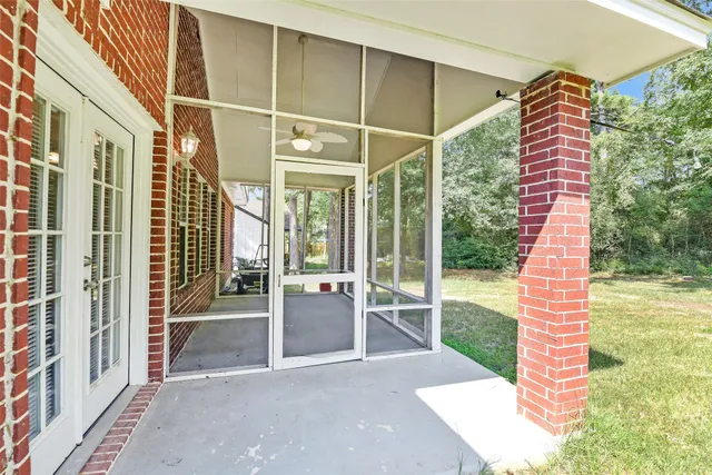 a view of a backyard with a garden and entertaining space