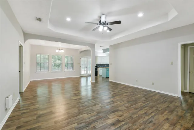 a kitchen with granite countertop a sink and cabinets