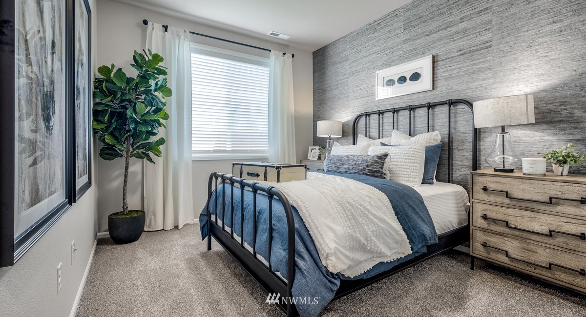 23435 41st Drive Southeast, Unit 33 Bothell, WA 98021 - Photo 11 of 24 a bedroom with bed and a window