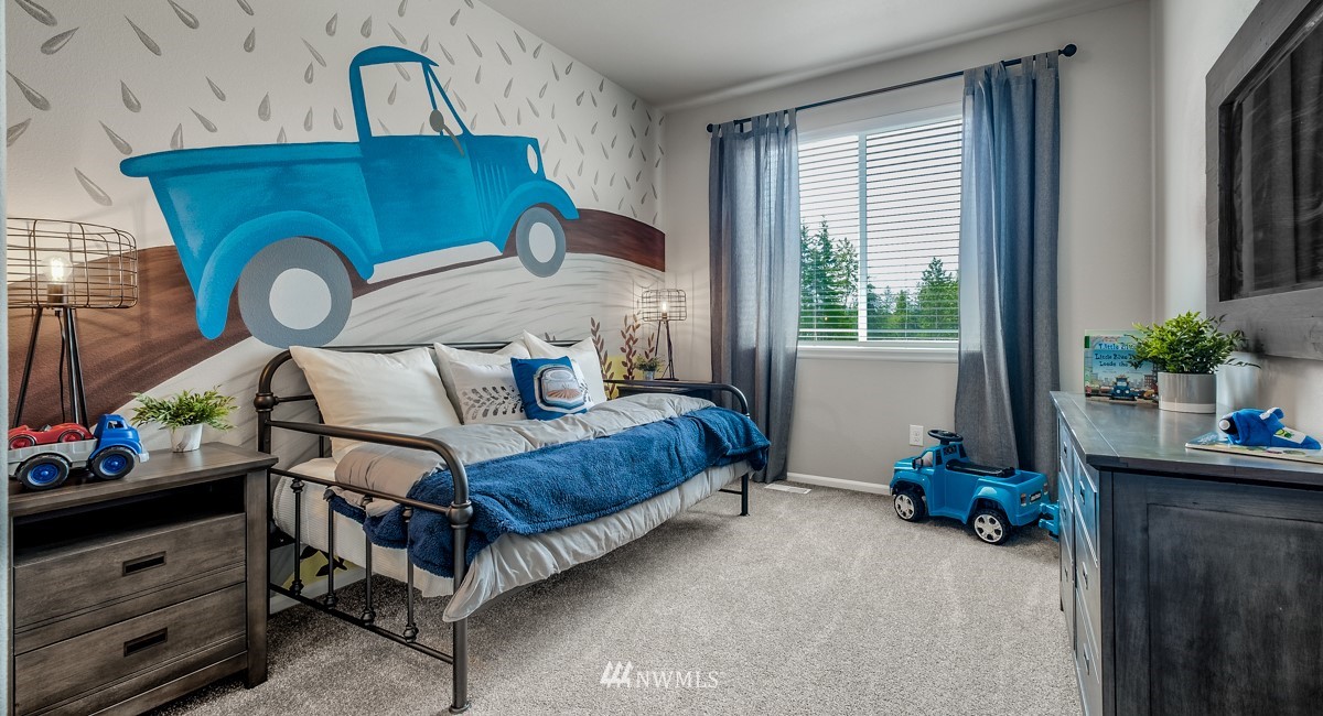 23435 41st Drive Southeast, Unit 33 Bothell, WA 98021 - Photo 14 of 24 a bedroom with bed and a window