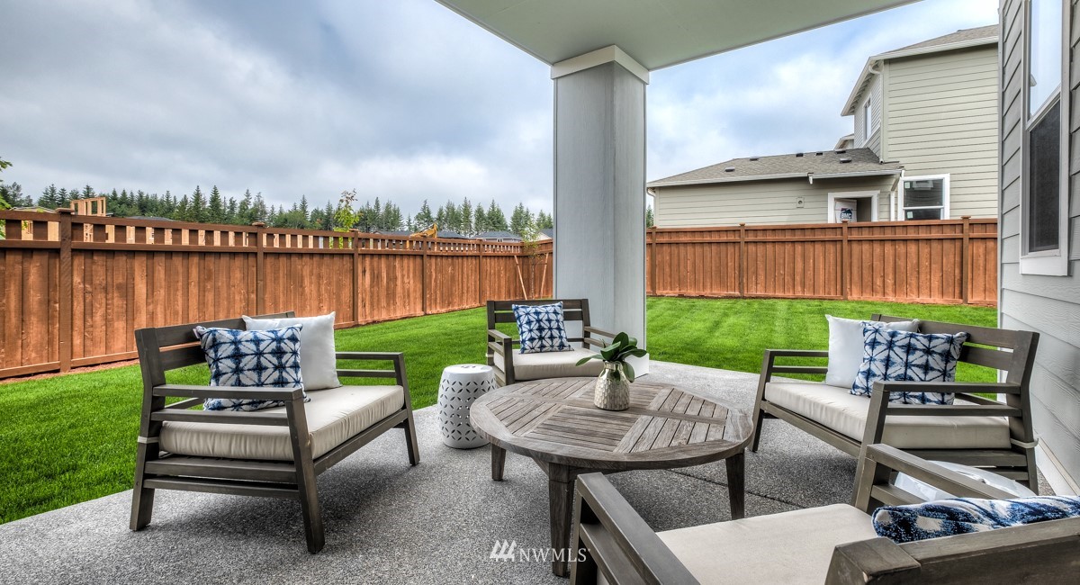 23435 41st Drive Southeast, Unit 33 Bothell, WA 98021 - Photo 24 of 24 a view of a patio with couches chairs and a yard