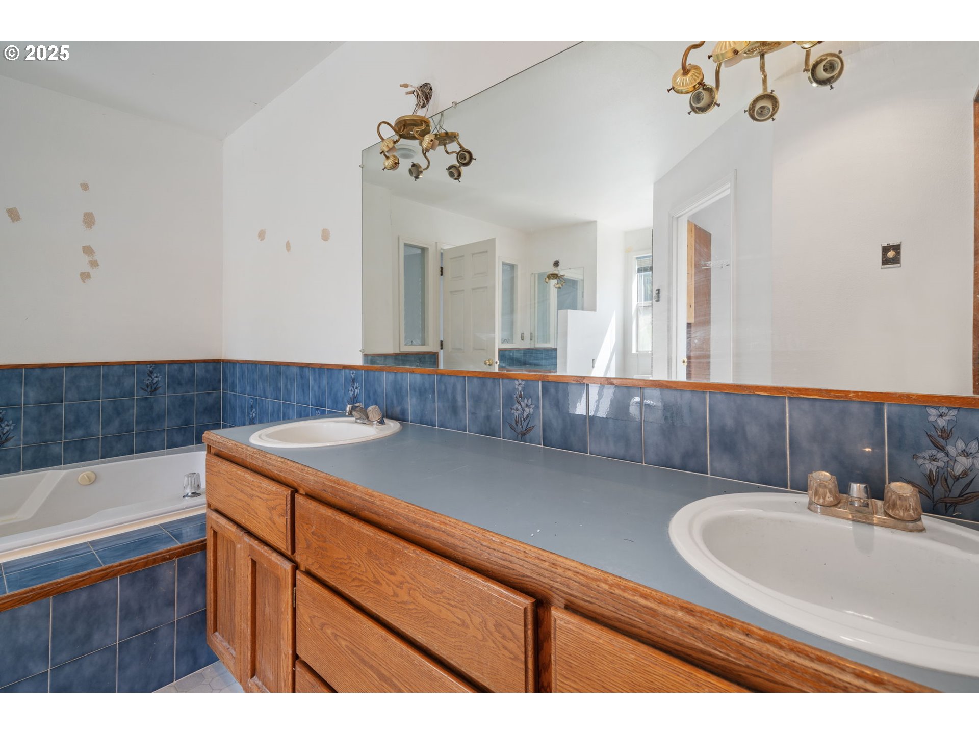 3411 Northeast 179th Street Ridgefield, WA 98642 - Photo 34 of 48 a bathroom with a sink and a mirror