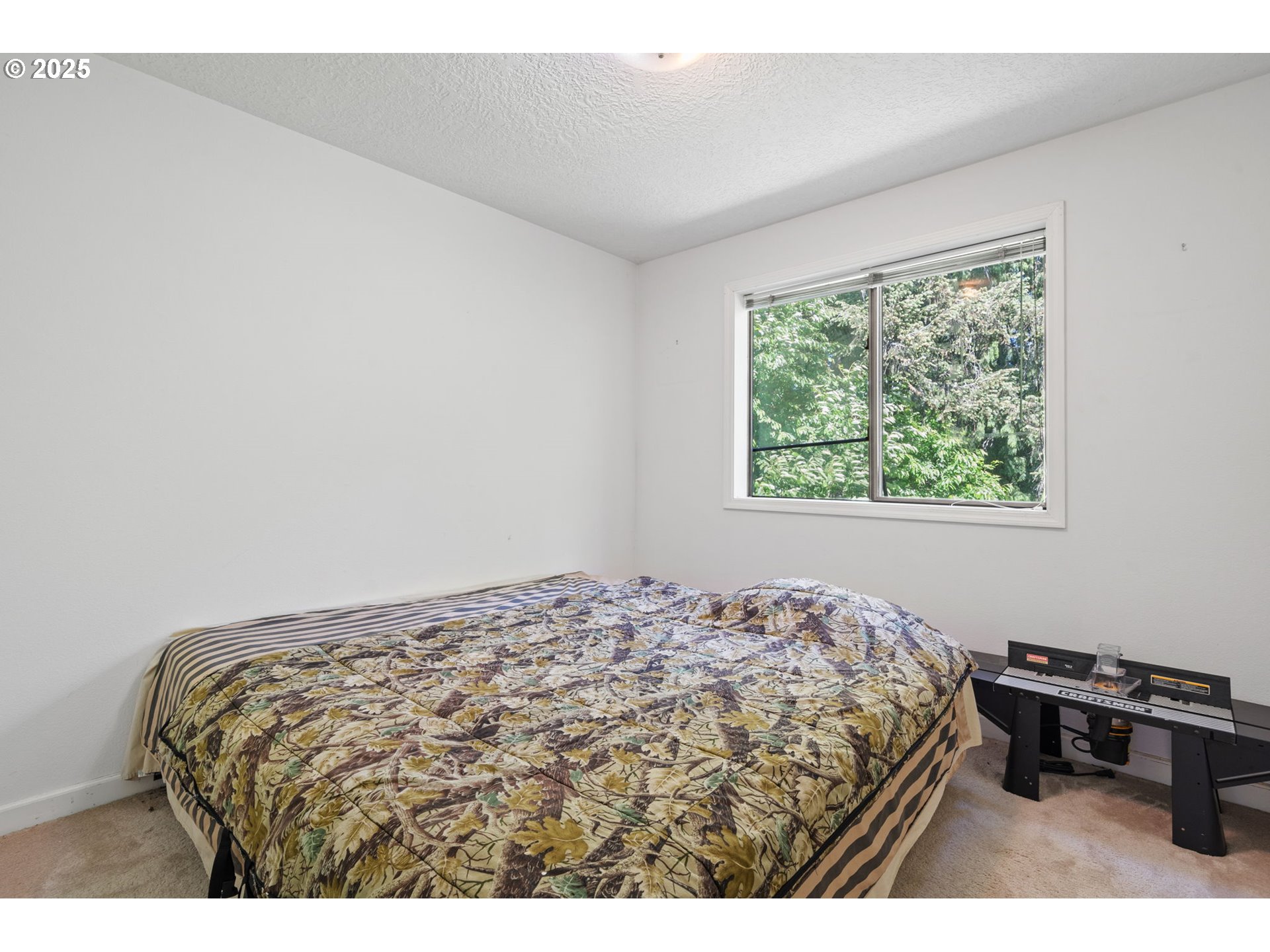 3411 Northeast 179th Street Ridgefield, WA 98642 - Photo 37 of 48 a bedroom with a bed and a window
