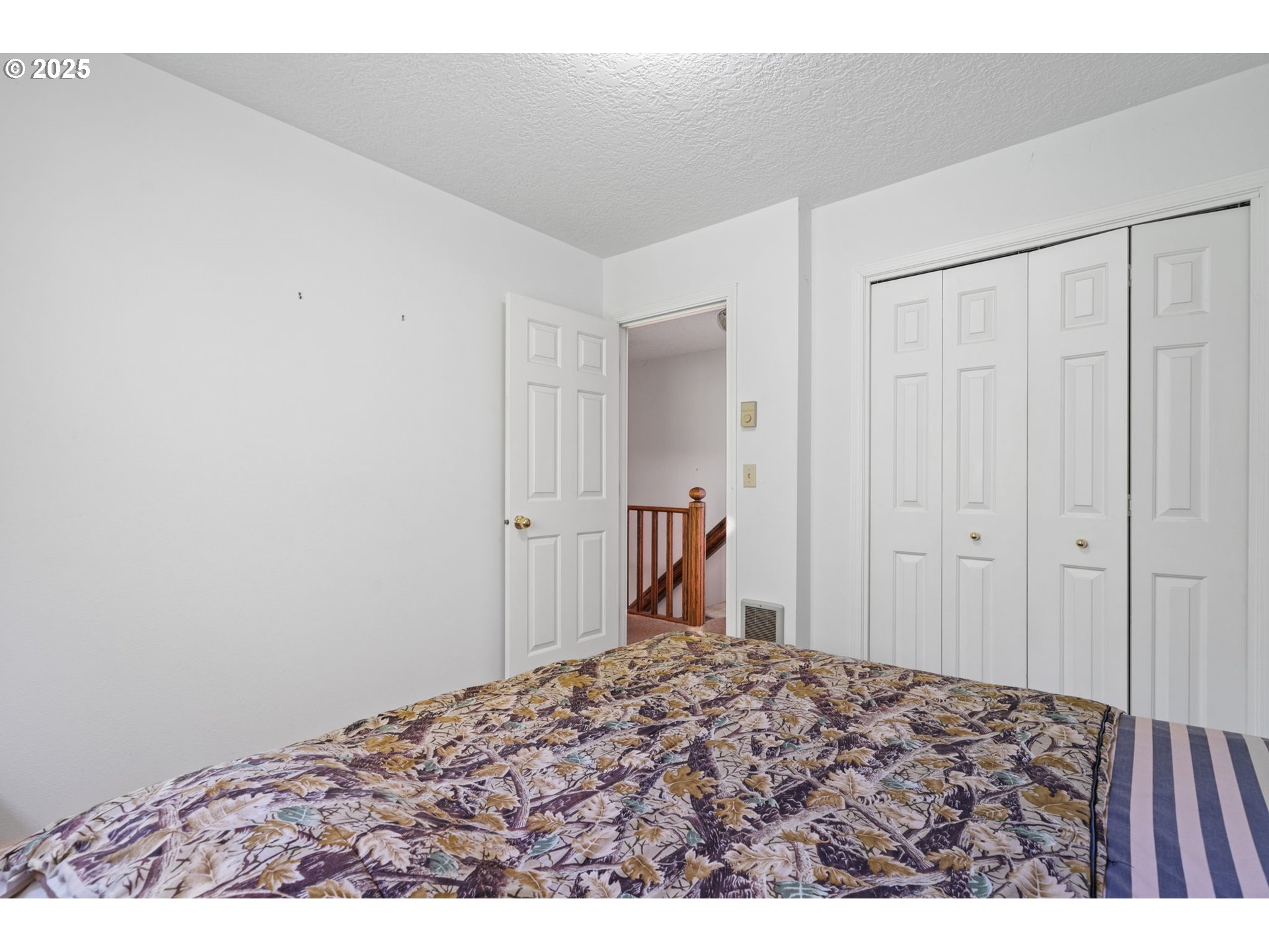 3411 Northeast 179th Street Ridgefield, WA 98642 - Photo 38 of 48 a bedroom with a bed and a view of bathroom