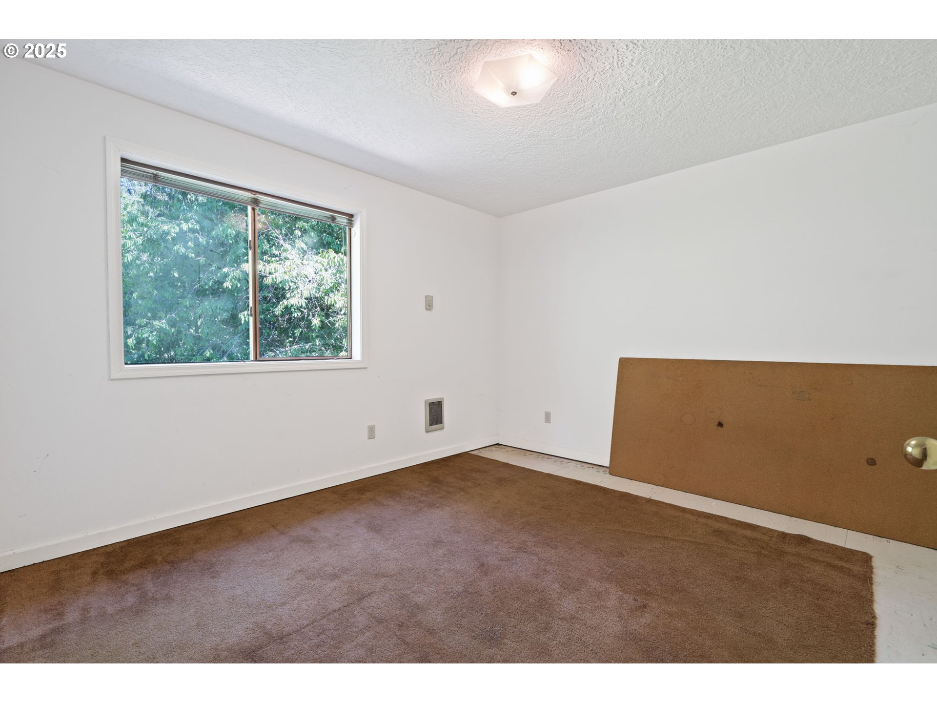3411 Northeast 179th Street Ridgefield, WA 98642 - Photo 41 of 48 a view of an empty room with a window