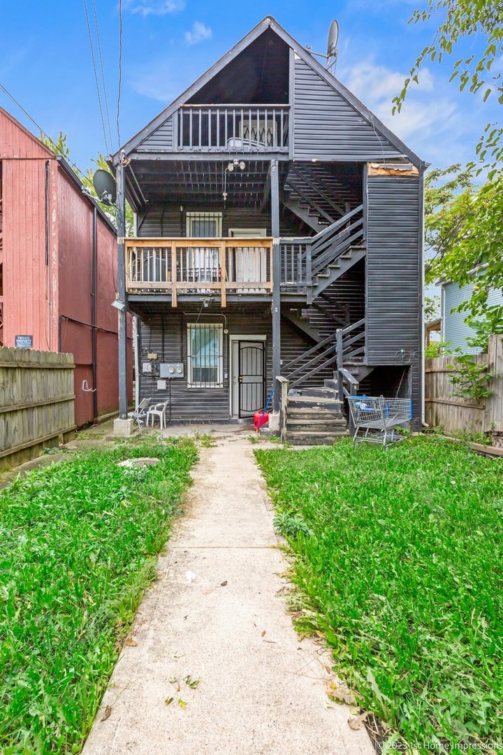 8807 South Lowe Avenue Chicago, IL 60620 - Photo 19 of 19 a front view of a house with a garden