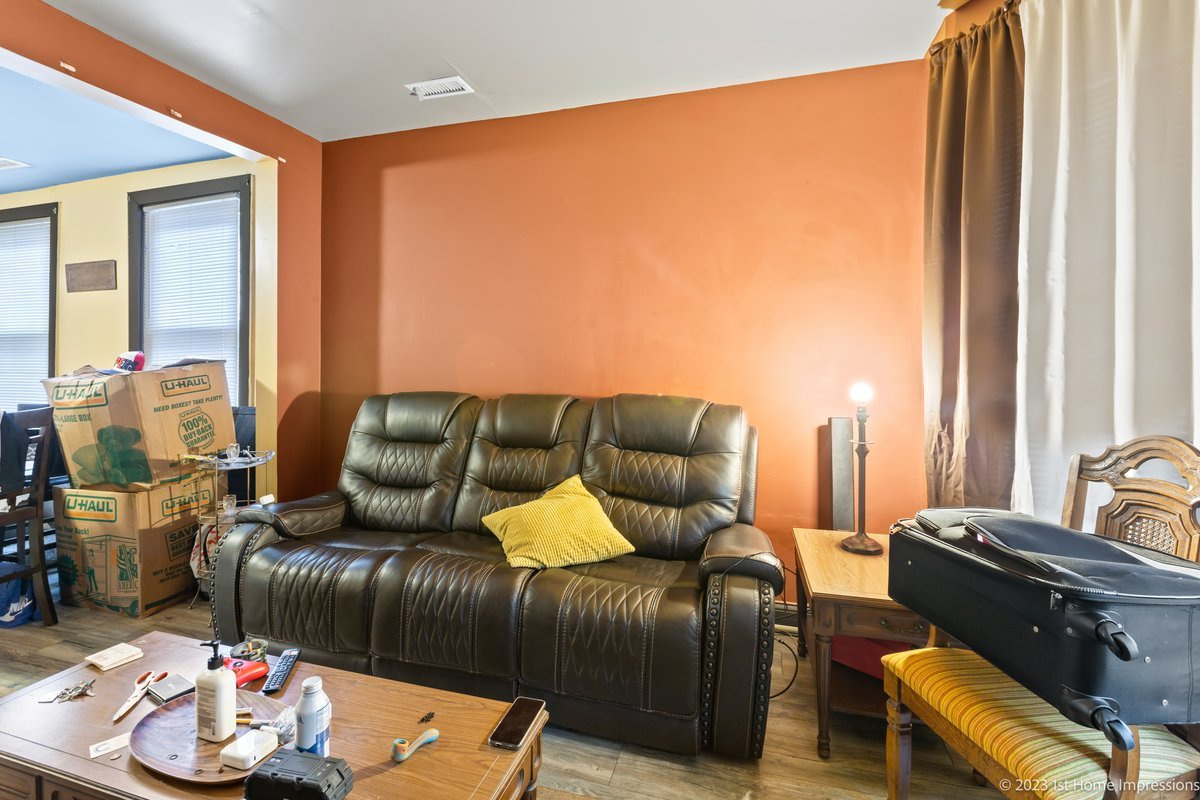 8807 South Lowe Avenue Chicago, IL 60620 - Photo 3 of 19 a living room with furniture and a large window