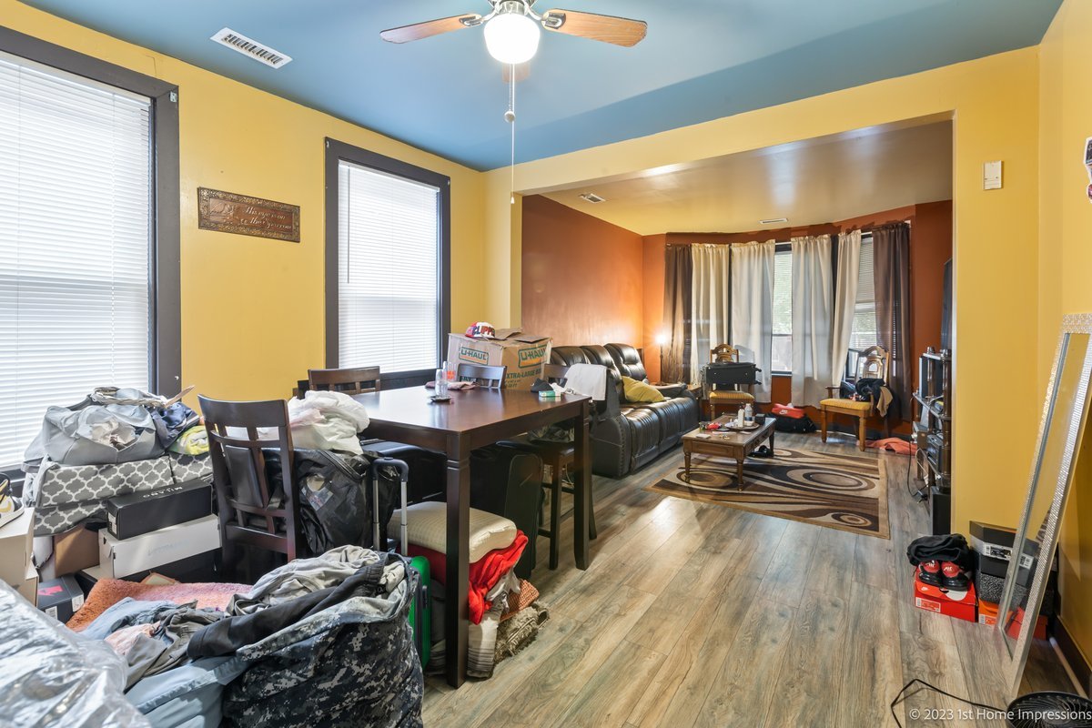 8807 South Lowe Avenue Chicago, IL 60620 - Photo 5 of 19 a living room with furniture and a large window