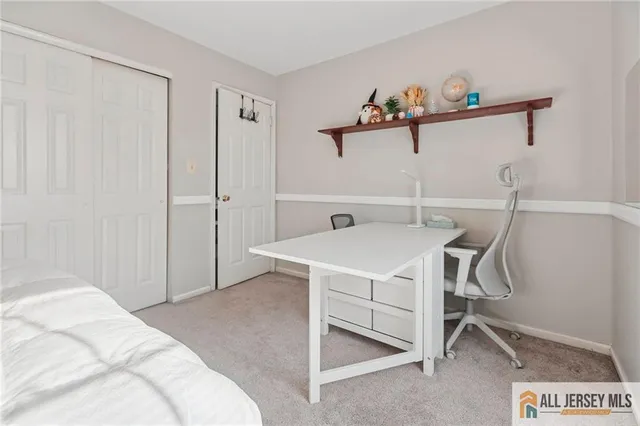 a bedroom with a bed and a table in it