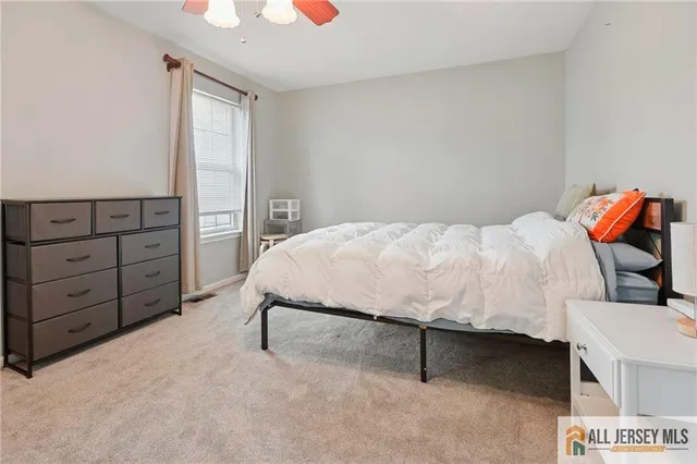 a bedroom with a bed and a cabinets