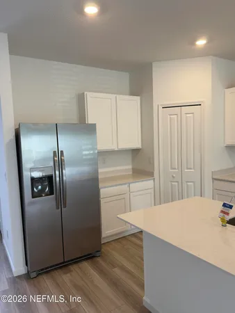 a kitchen with a sink a stove and refrigerator