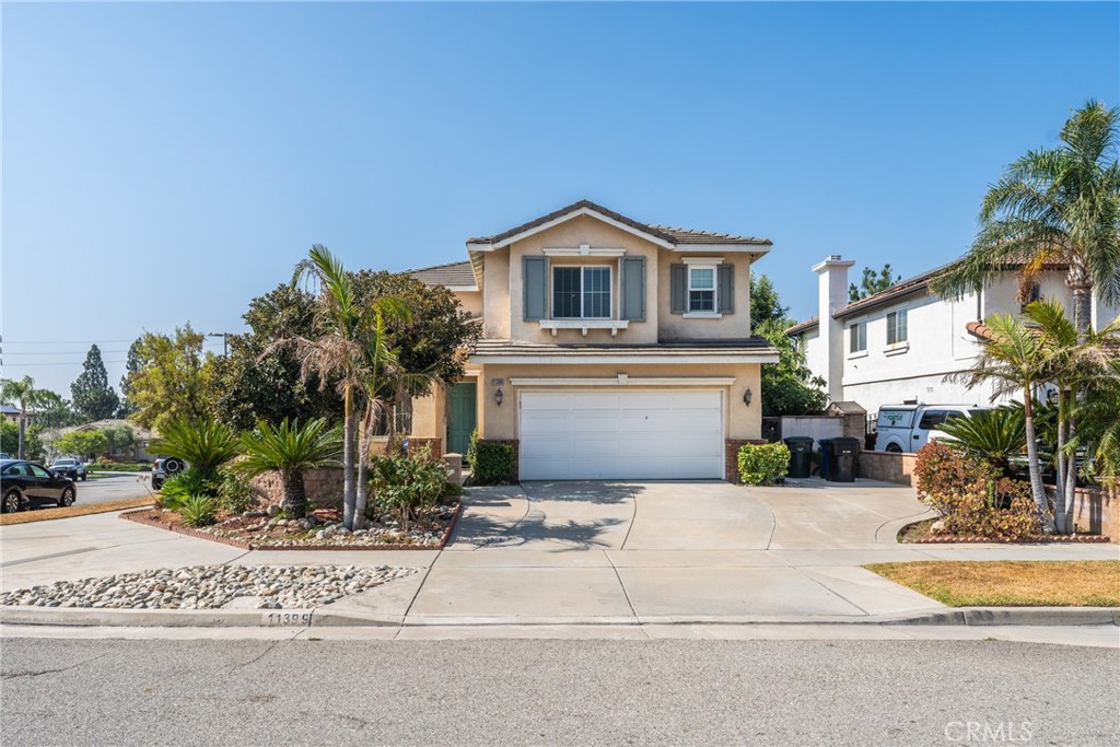 11399 Williams Ridge Drive Rancho Cucamonga, CA 91701 - Photo 1 of 1 a house with palm tree in front of it
