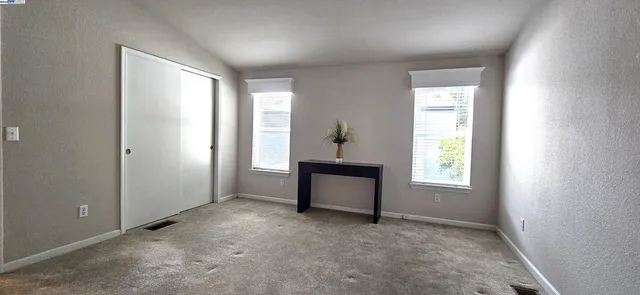 an empty room with windows