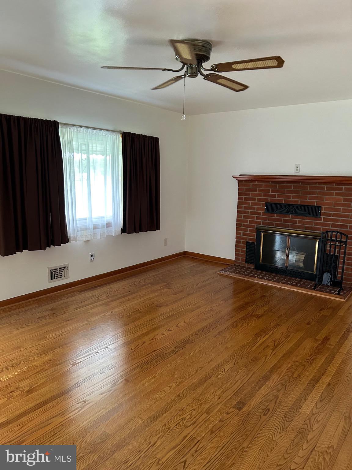 2523 Mountain Road Joppa, MD 21085 - Photo 25 of 35 Living room with brick FP