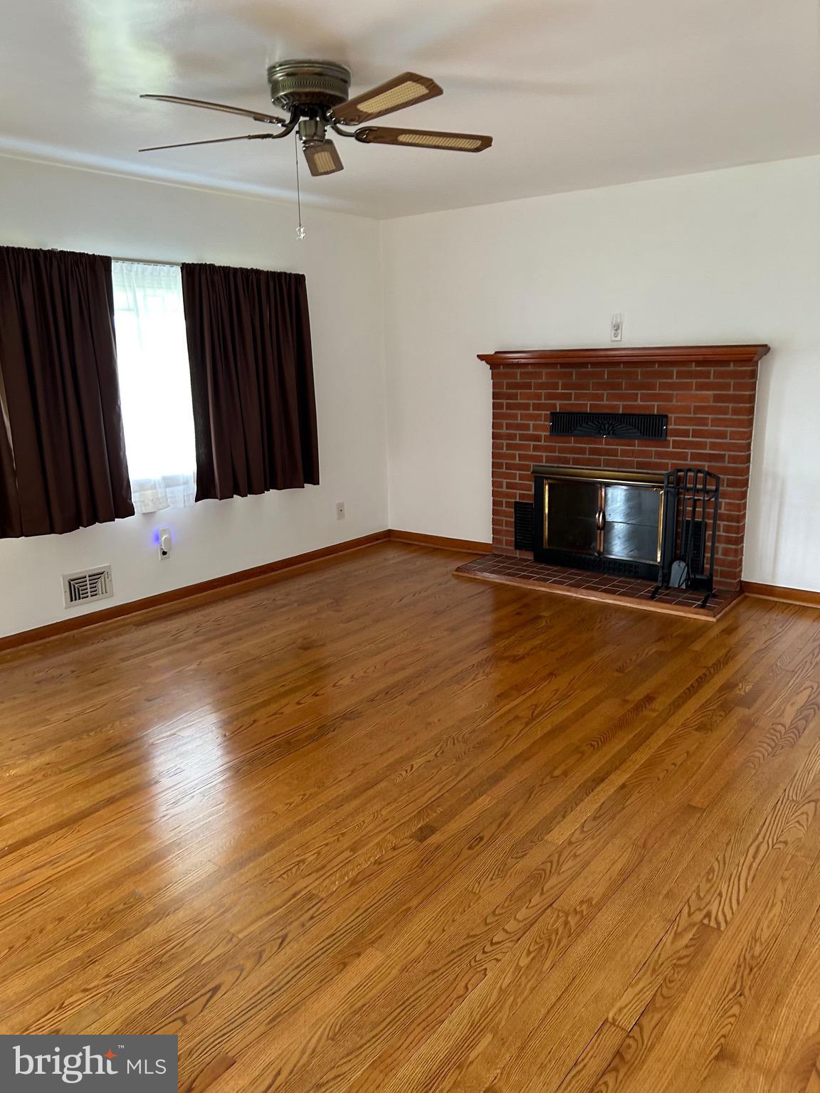 2523 Mountain Road Joppa, MD 21085 - Photo 3 of 35 Living room with brick fireplace