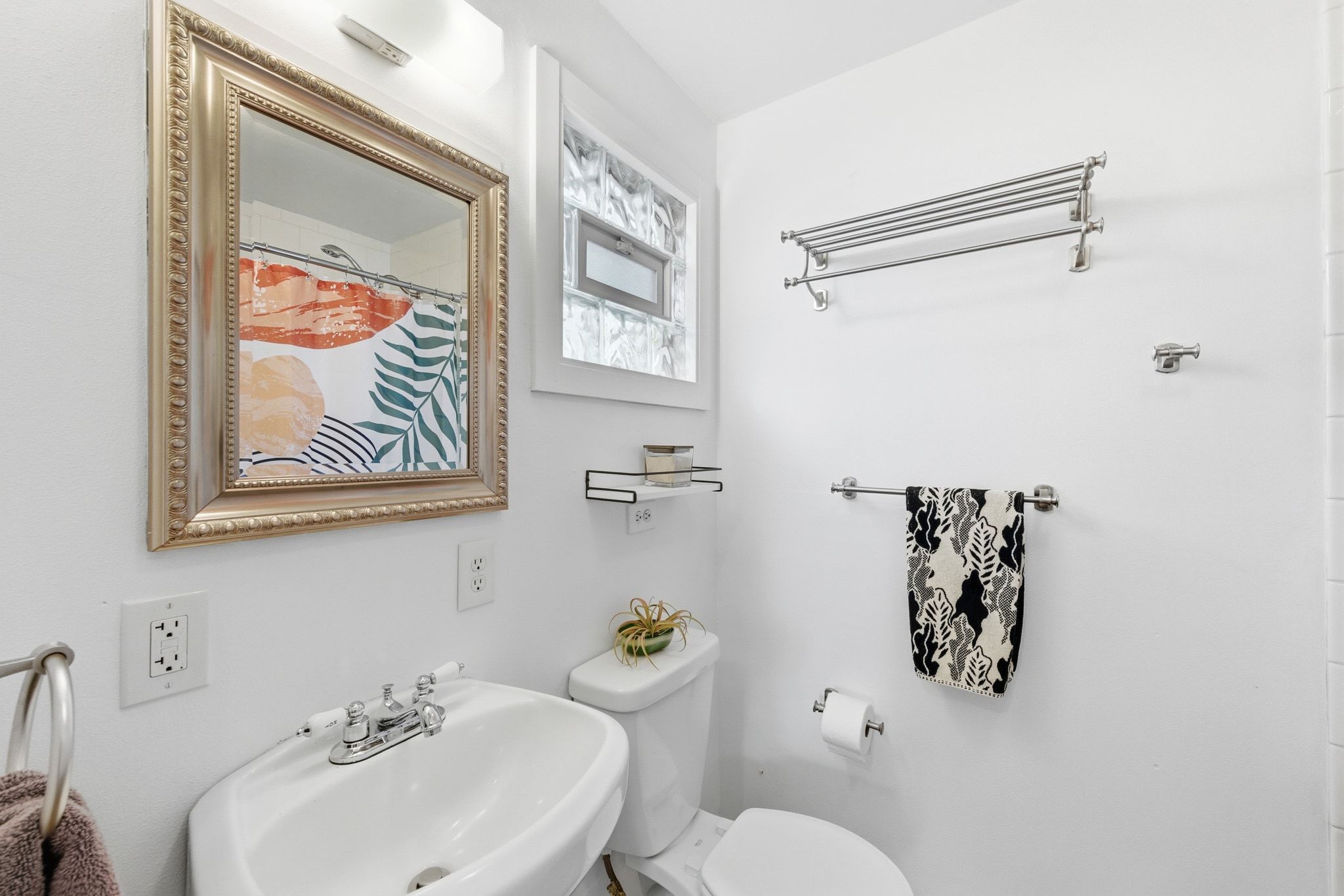 1706 Riverview Street, Unit A Austin, TX 78702 - Photo 17 of 23 a bathroom with a sink mirror and toilet